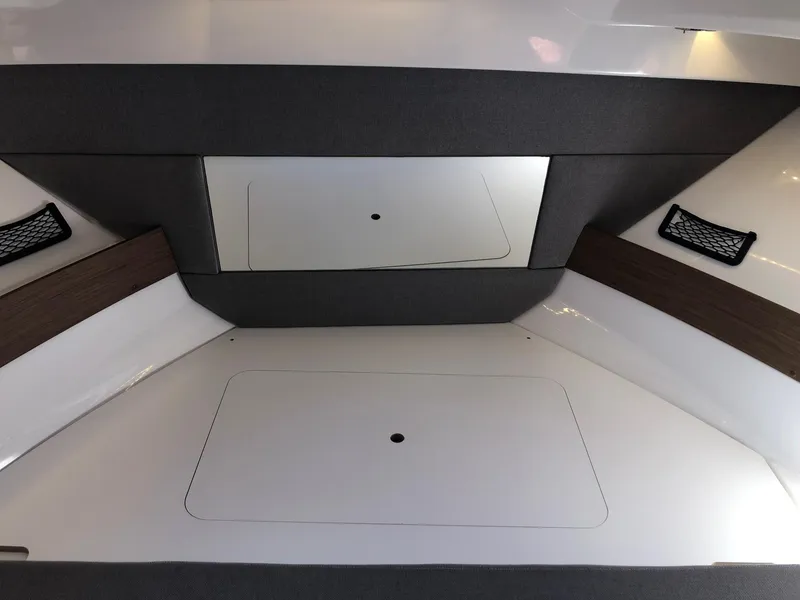 Slide: The Image of Interior cabin of 2018 Jeanneau NC 895 boat, featuring sleek design and storage compartments. - 20