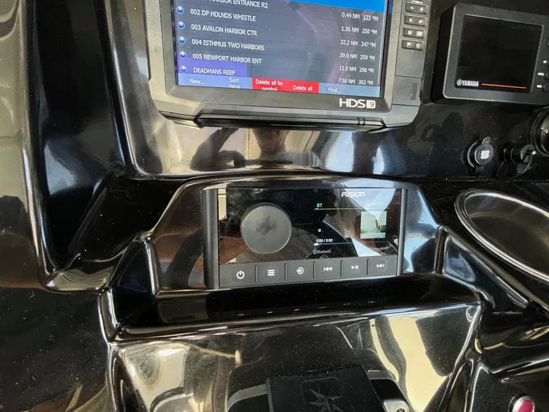 Slide: The Image of Control panel of a 2018 Jeanneau NC 895 boat with navigation and audio systems. - 28