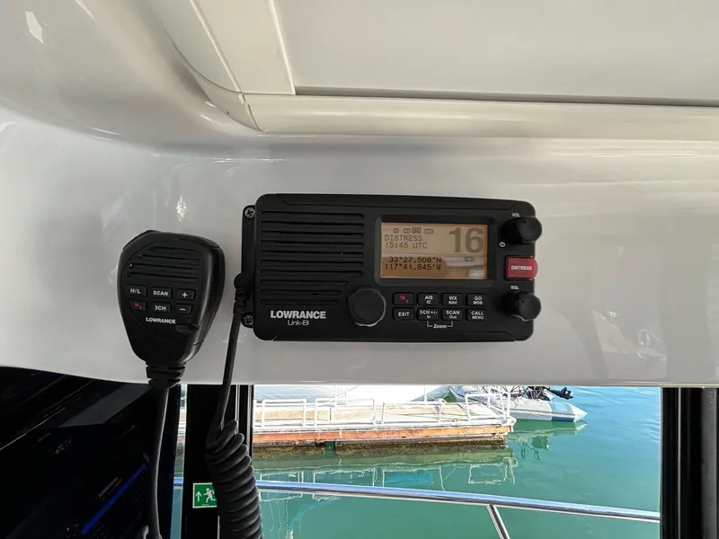 Slide: The Image of Lowrance marine radio on 2018 Jeanneau NC 895 boat, docked at marina. - 32
