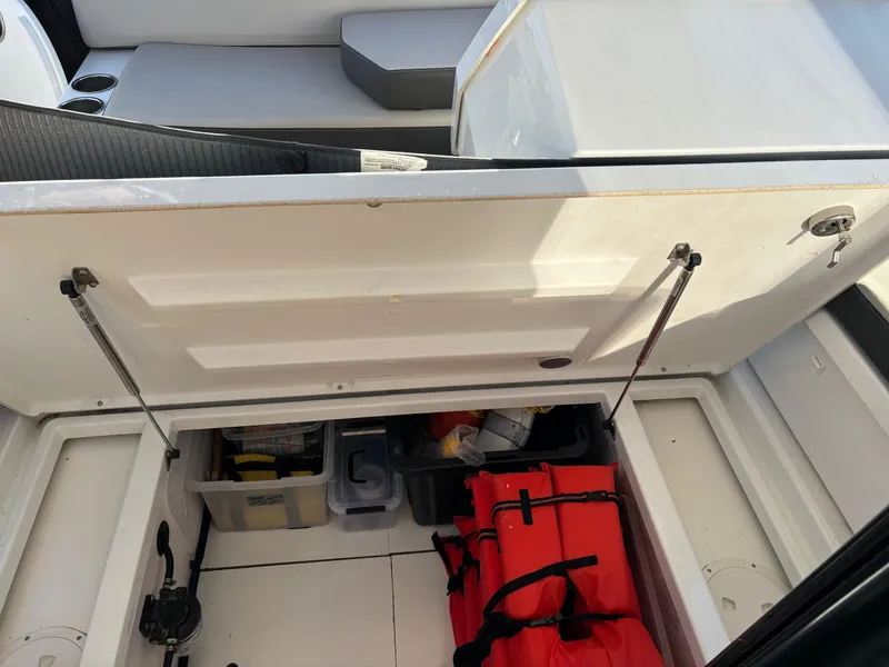 Slide: The Image of 2018 Jeanneau NC 895 storage compartment with safety gear and equipment. - 39