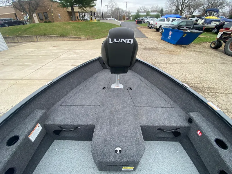 Slide: The Image of 2025 Lund 1775 Pro Guide boat interior with seating and storage compartments. - 10