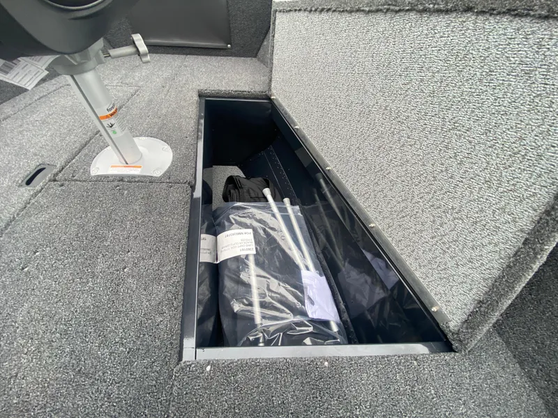 Slide: The Image of 2025 Lund 1775 Pro Guide boat storage compartment with accessories. - 12