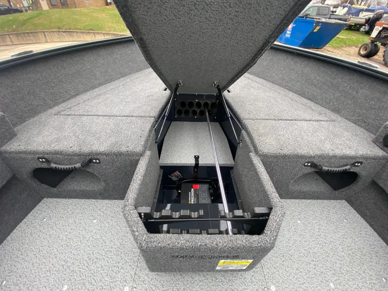 Slide: The Image of 2025 Lund 1775 Pro Guide boat interior with open storage compartment. - 13