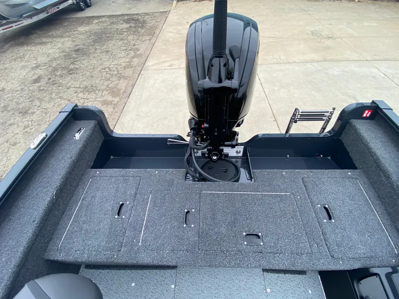 Slide: The Image of 2025 Lund 1775 Pro Guide boat with motor, gray deck, and ladder. - 22