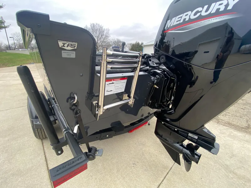 Slide: The Image of 2025 Lund 1775 Pro Guide boat with Mercury outboard motor, rear view. - 29