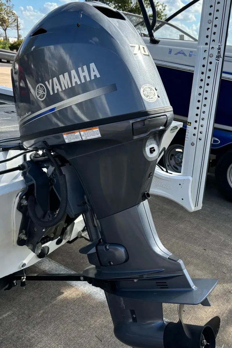 Slide: The Image of Yamaha outboard motor on 2021 G3 Sportsman 1710 boat, parked outdoors. - 7