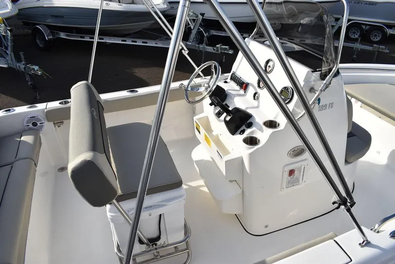 Slide: The Image of 2025 Key West 189 FS boat interior with steering console and seating. - 10