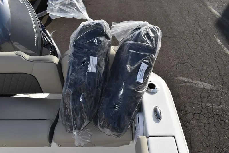 Slide: The Image of 2025 Key West 189 FS boat with packaged accessories on seat. - 23