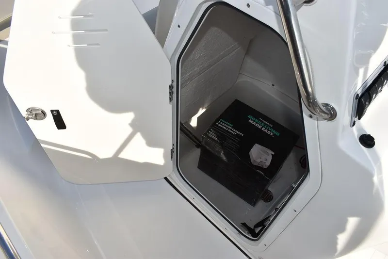 Slide: The Image of Open storage compartment on 2025 Key West 189 FS boat. - 25