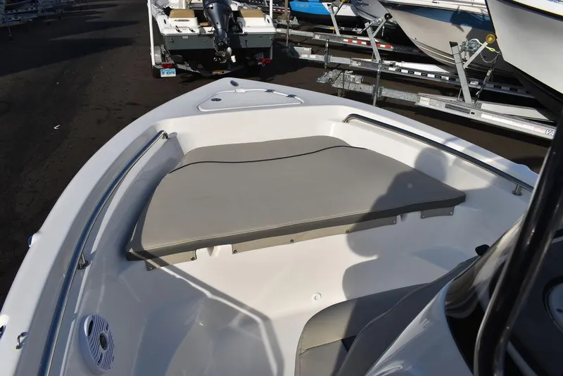 Slide: The Image of 2025 Key West 189 FS boat interior with cushioned seating and storage. - 26