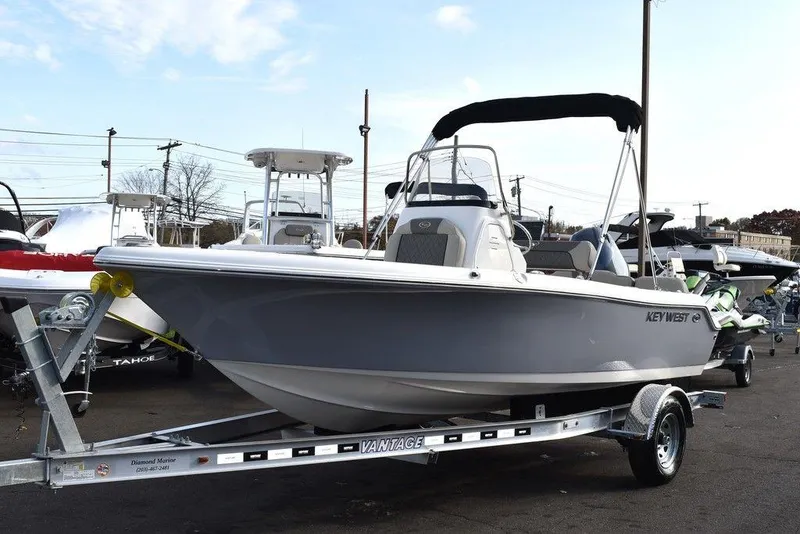Slide: The Image of 2025 Key West 189 FS boat on trailer, displayed outdoors. - 3