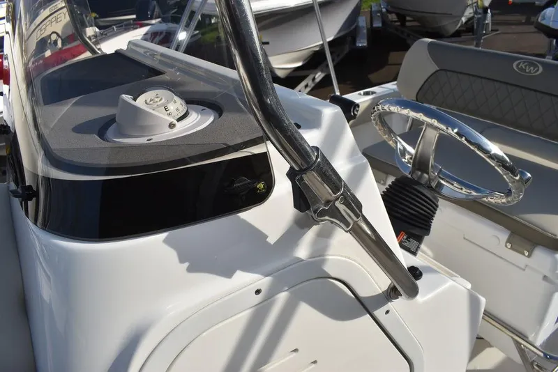 Slide: The Image of 2025 Key West 189 FS boat console with steering wheel and controls. - 31