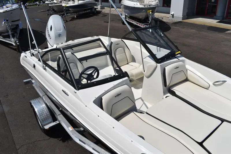 Slide: The Image of 2023 Stingray 191DC boat with sleek white interior and modern design. - 11