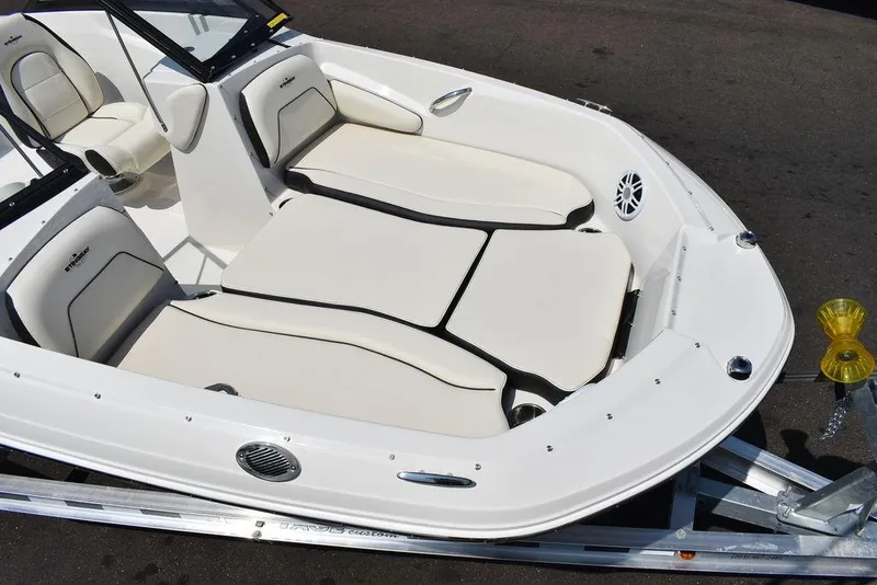 Slide: The Image of 2023 Stingray 191DC boat interior with white seating and sleek design. - 12