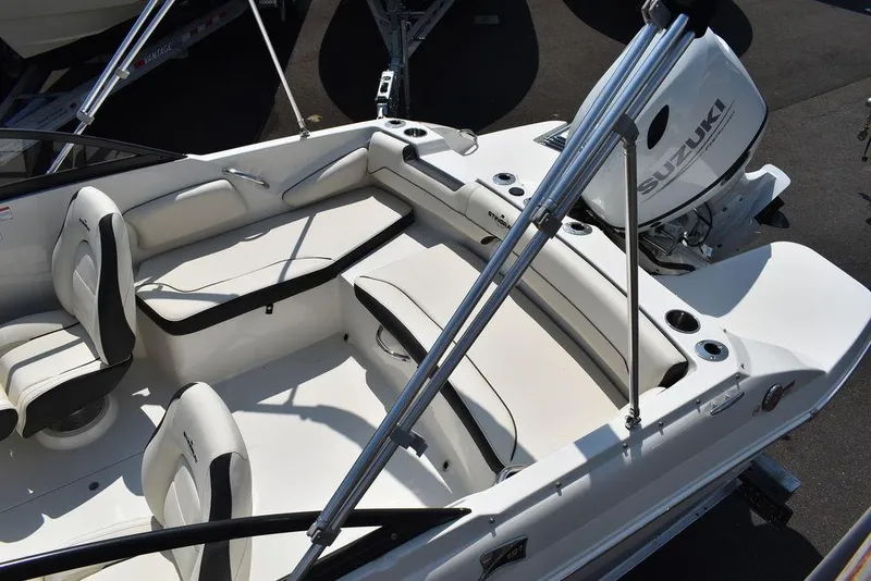 Slide: The Image of 2023 Stingray 191DC boat interior with Suzuki engine, featuring white seating and sleek design. - 16