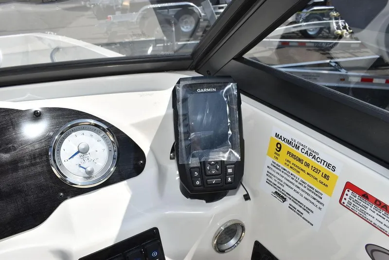 Slide: The Image of 2023 Stingray 191DC dashboard with Garmin device and capacity label. - 26