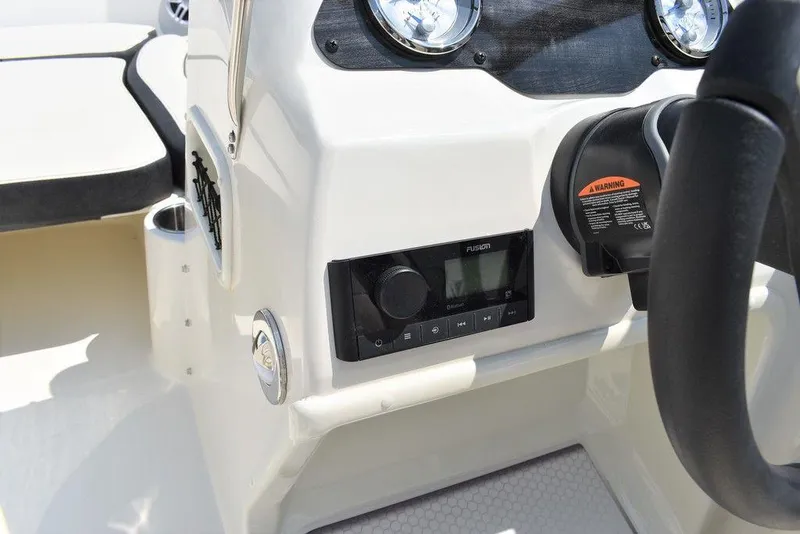 Slide: The Image of 2023 Stingray 191DC boat dashboard with modern controls and steering wheel. - 27