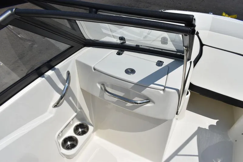 Slide: The Image of 2023 Stingray 191DC boat interior with cup holders and sleek design. - 33