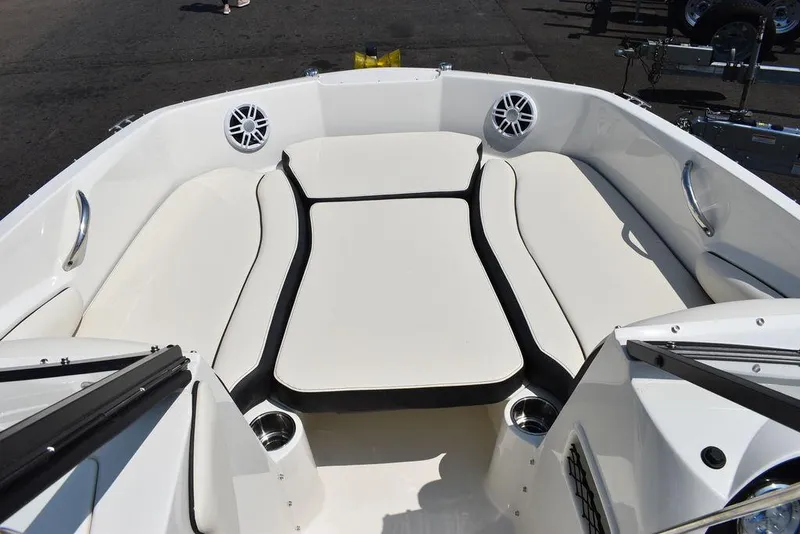 Slide: The Image of 2023 Stingray 191DC boat interior with cushioned seating and cup holders. - 37