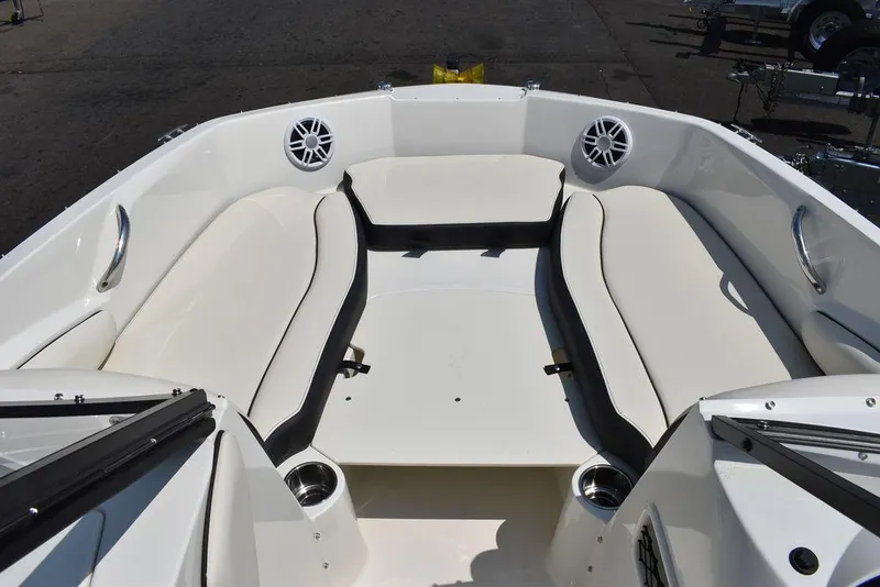 Slide: The Image of 2023 Stingray 191DC boat interior with white seating and cup holders. - 38