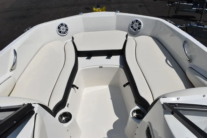Slide: The Image of 2023 Stingray 191DC boat interior with white seating and cup holders. - 39