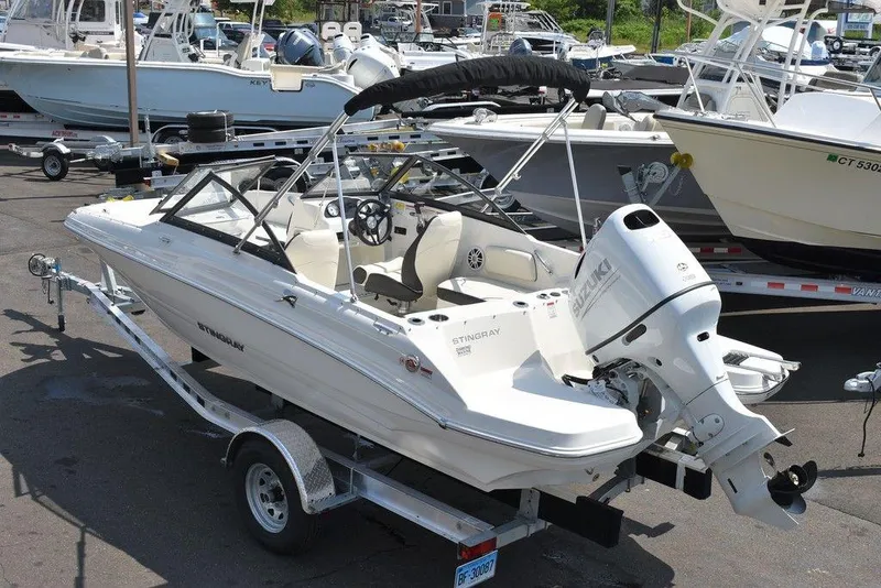 Slide: The Image of 2023 Stingray 191DC boat on trailer, parked in marina. - 4