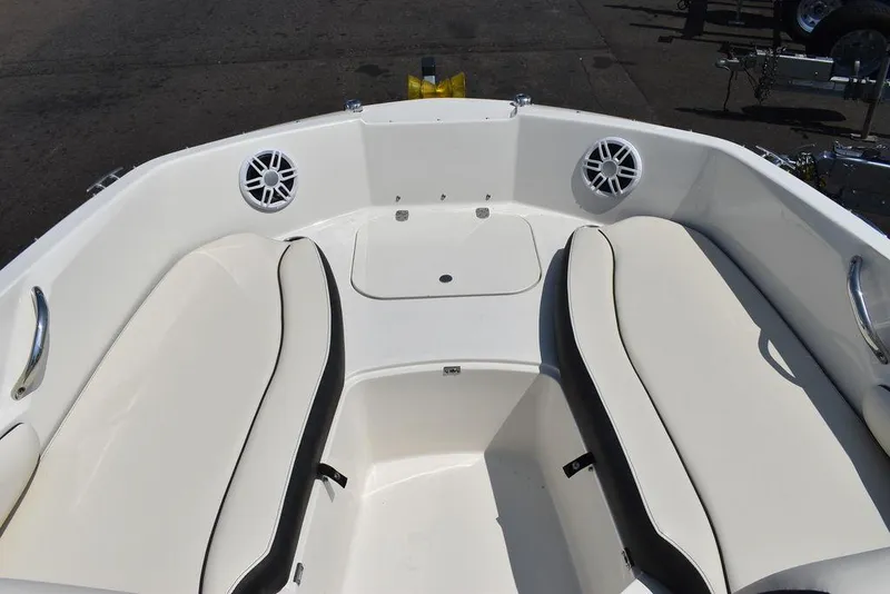 Slide: The Image of 2023 Stingray 191DC boat interior with white seating and speakers. - 40