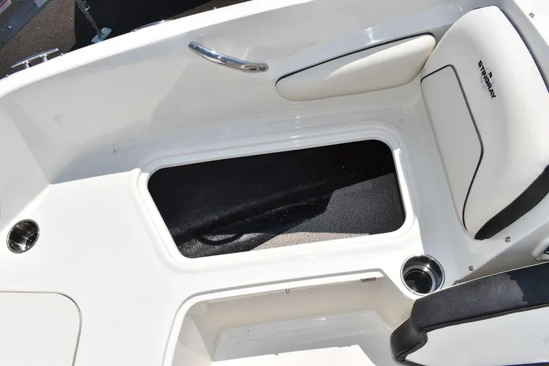 Slide: The Image of 2023 Stingray 191DC boat interior storage compartment and seating area. - 43