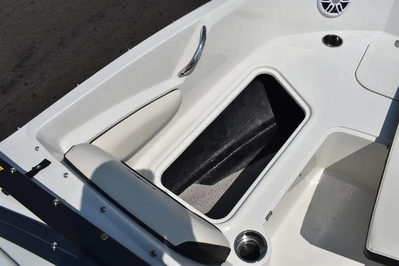 Slide: The Image of 2023 Stingray 191DC boat interior with storage compartment and seating. - 44
