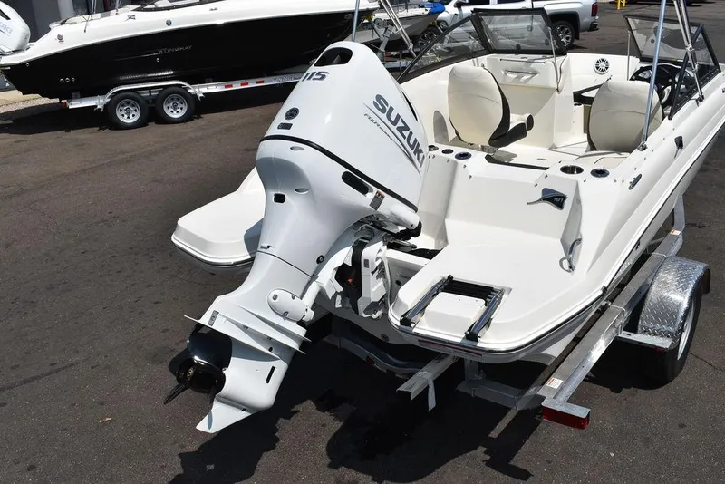 Slide: The Image of 2023 Stingray 191DC boat with Suzuki outboard motor on trailer. - 6