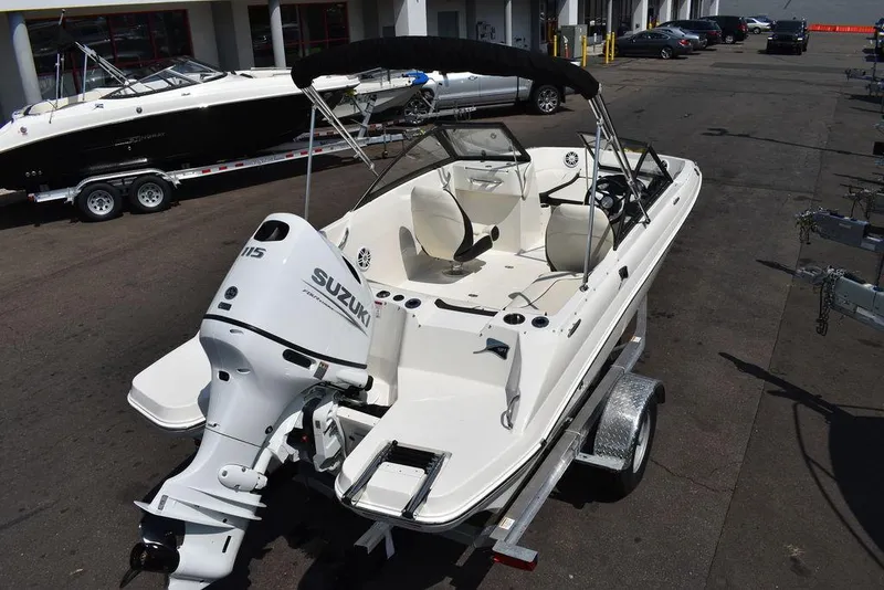 Slide: The Image of 2023 Stingray 191DC boat with Suzuki outboard motor on trailer. - 7