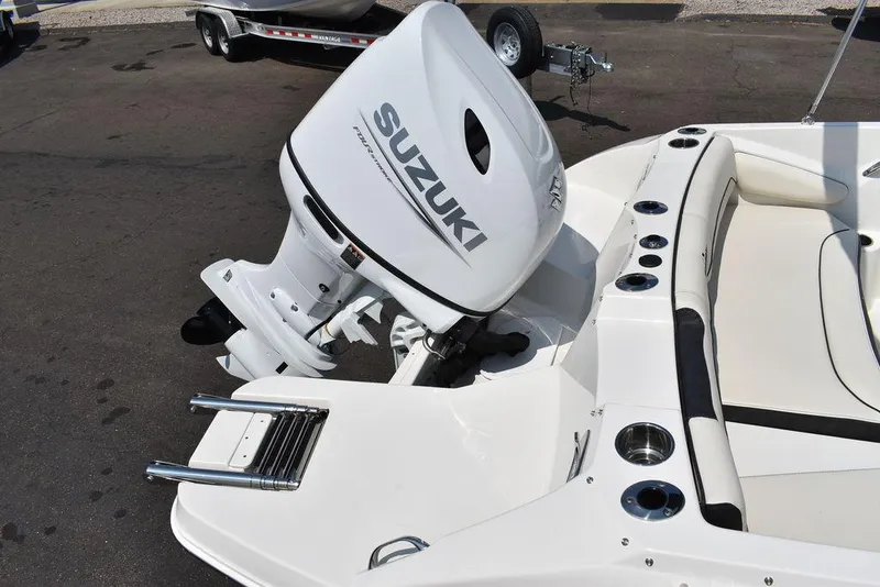Slide: The Image of 2023 Stingray 191DC boat with Suzuki outboard motor, rear view. - 8