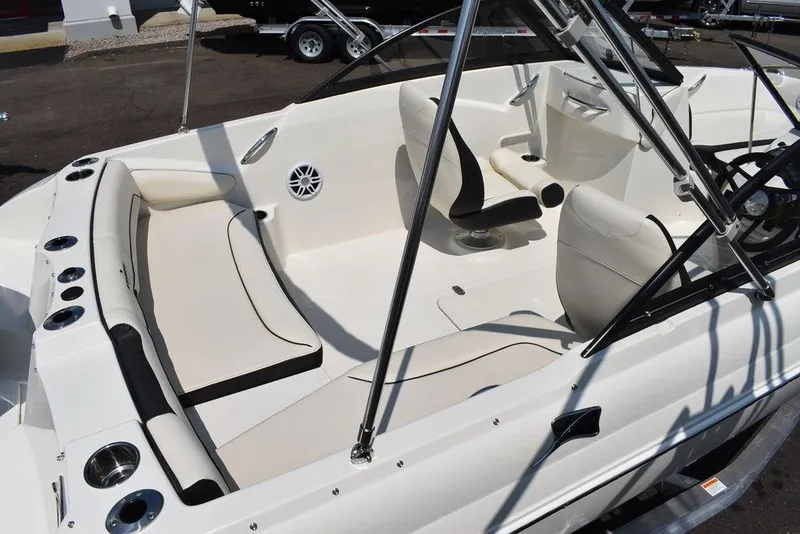 Slide: The Image of 2023 Stingray 191DC boat interior with white seating and sleek design. - 9