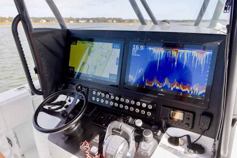 Slide: The Image of Contender 39 ST 2020 boat dashboard with navigation and sonar displays. - 8