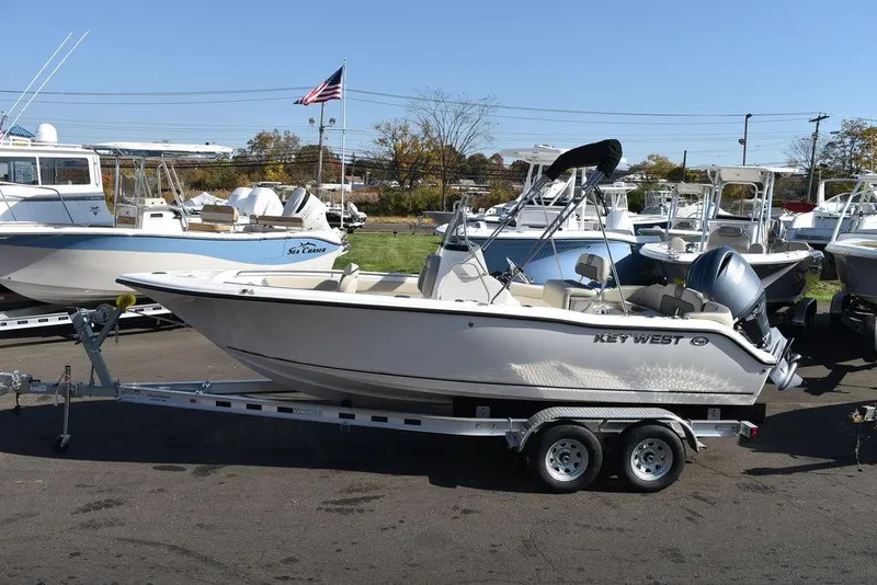 The Image of 2025 Key West 203 FS boat on trailer, parked outdoors. - 1