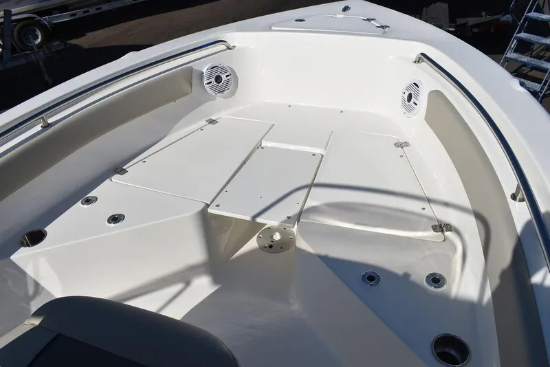 Slide: The Image of 2025 Key West 203 FS boat interior with seating and speakers. - 11