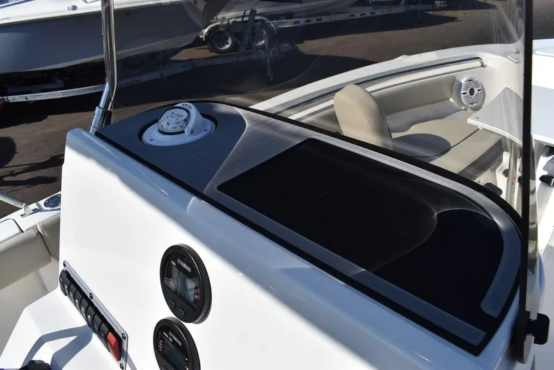 Slide: The Image of 2025 Key West 203 FS boat dashboard with gauges and seating area. - 20