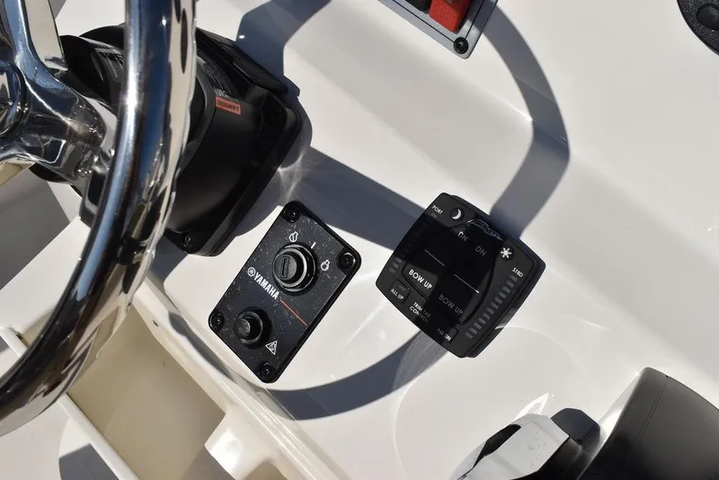 Slide: The Image of Key West 203 FS 2025 boat dashboard with Yamaha controls and display. - 24