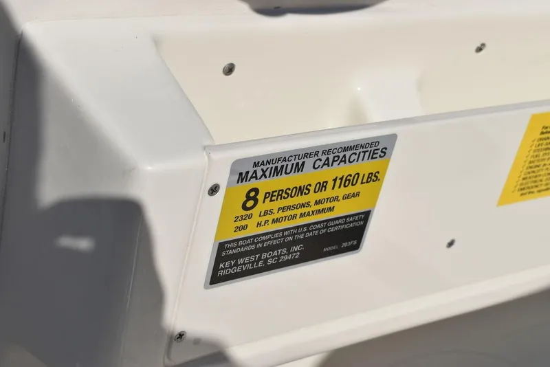 Slide: The Image of Key West 203 FS 2025 boat capacity label, 8 persons or 1160 lbs. - 26