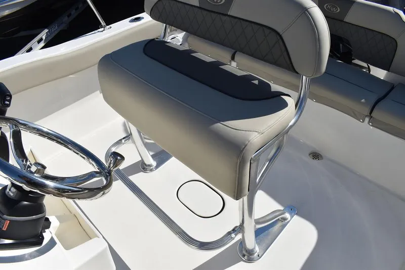 Slide: The Image of 2025 Key West 203 FS boat seat with chrome accents and steering wheel. - 28