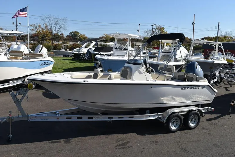 Slide: The Image of 2025 Key West 203 FS boat on trailer in marina setting. - 3