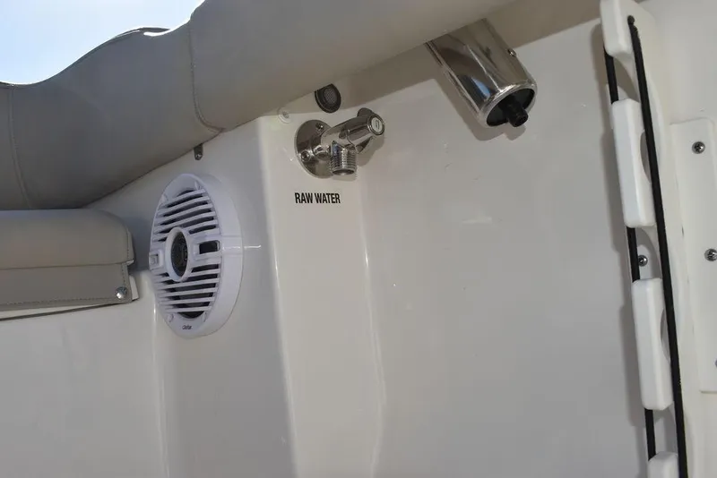 Slide: The Image of 2025 Key West 203 FS boat interior with raw water outlet and speaker. - 42