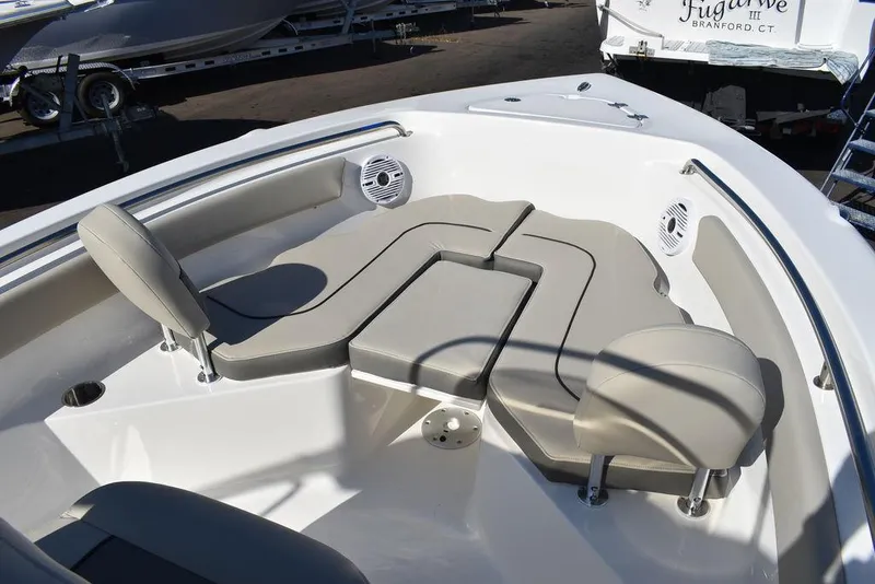 Slide: The Image of 2025 Key West 203 FS boat interior with cushioned seating and speakers. - 8