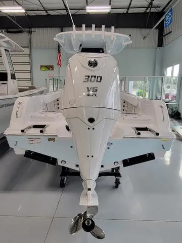 Slide: The Image of 2025 Sportsman Heritage 231 boat with powerful 300 V6 engine in showroom. - 10