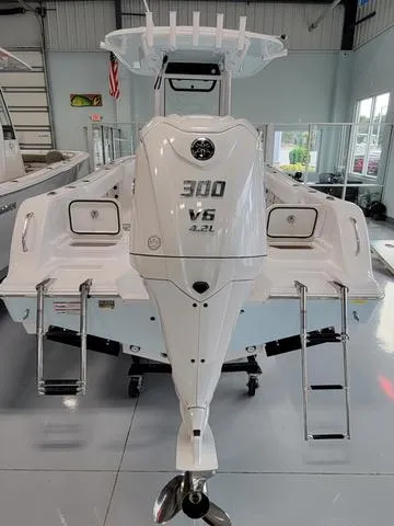 Slide: The Image of 2025 Sportsman Heritage 231 boat with powerful 300 V6 engine in showroom. - 11