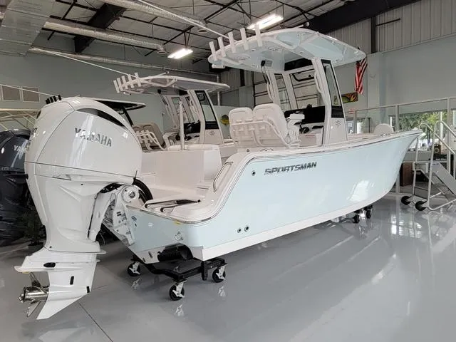 Slide: The Image of 2025 Sportsman Heritage 231 boat with Yamaha engine in showroom. - 13
