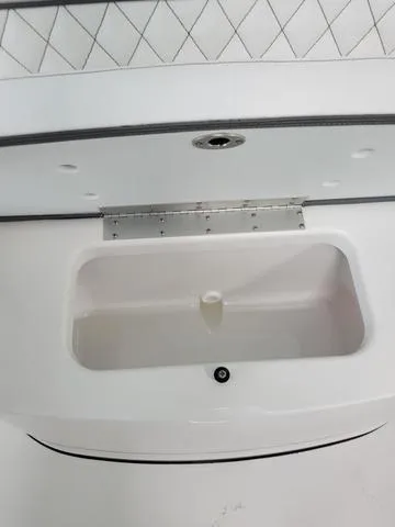 Slide: The Image of 2025 Sportsman Heritage 231 boat interior storage compartment. - 19