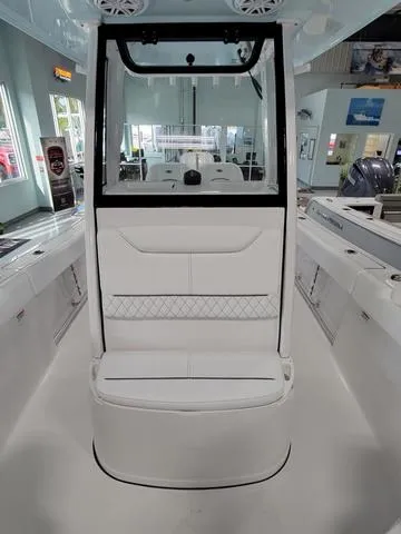 Slide: The Image of 2025 Sportsman Heritage 231 boat interior with sleek white seating and modern design. - 20