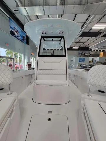 Slide: The Image of 2025 Sportsman Heritage 231 boat interior with modern seating and sleek design. - 21