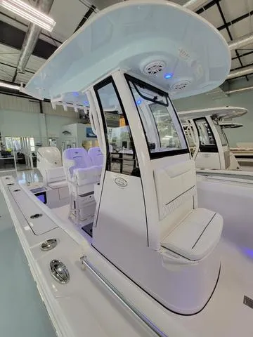 Slide: The Image of 2025 Sportsman Heritage 231 boat interior with modern seating and sleek design. - 27